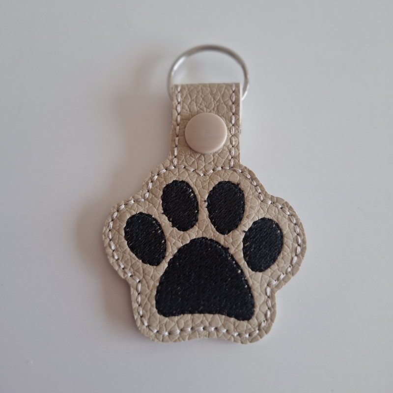 Sleutelhanger hondenpoot beige